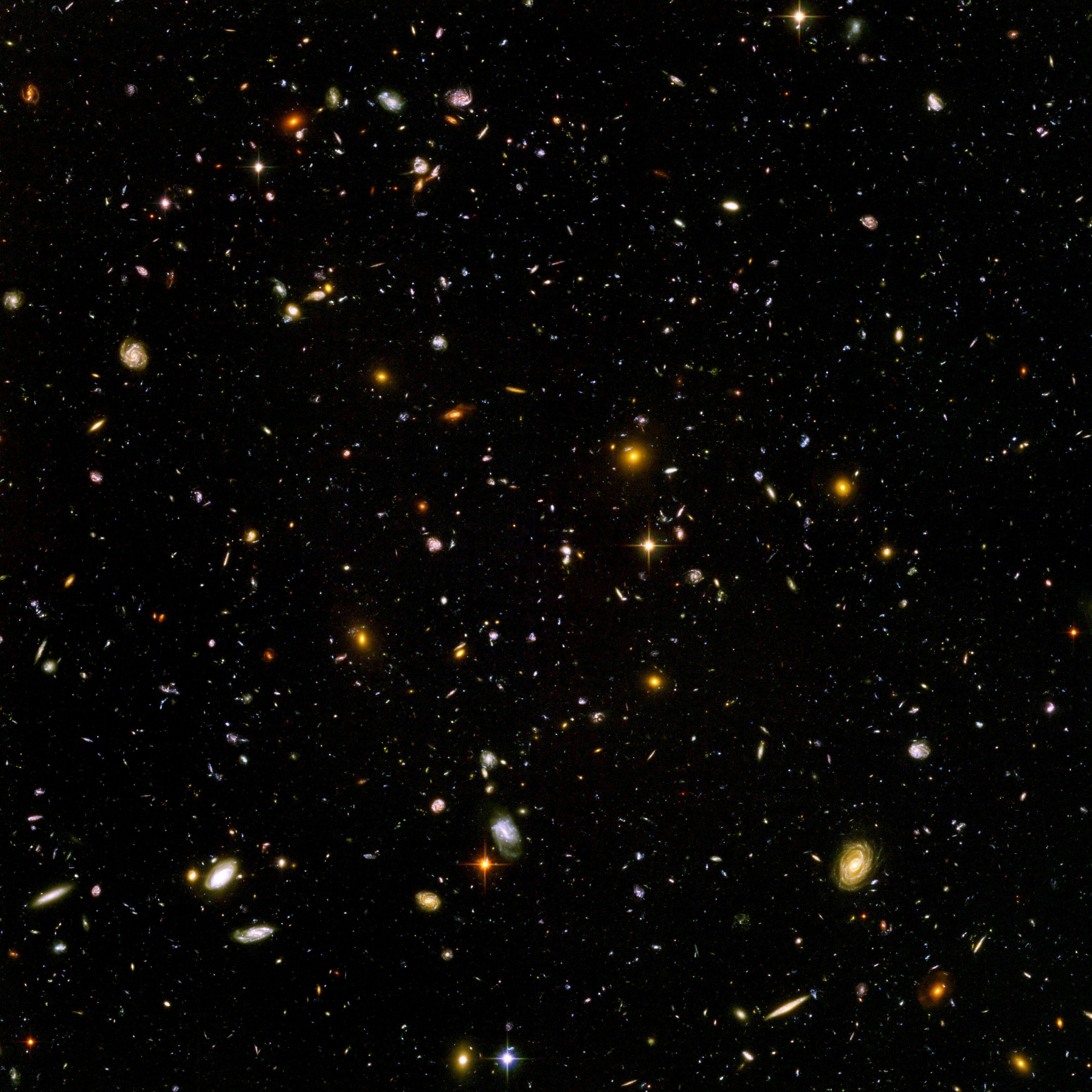 Ett djuprymdsfält fyllt med avlägsna galaxer.