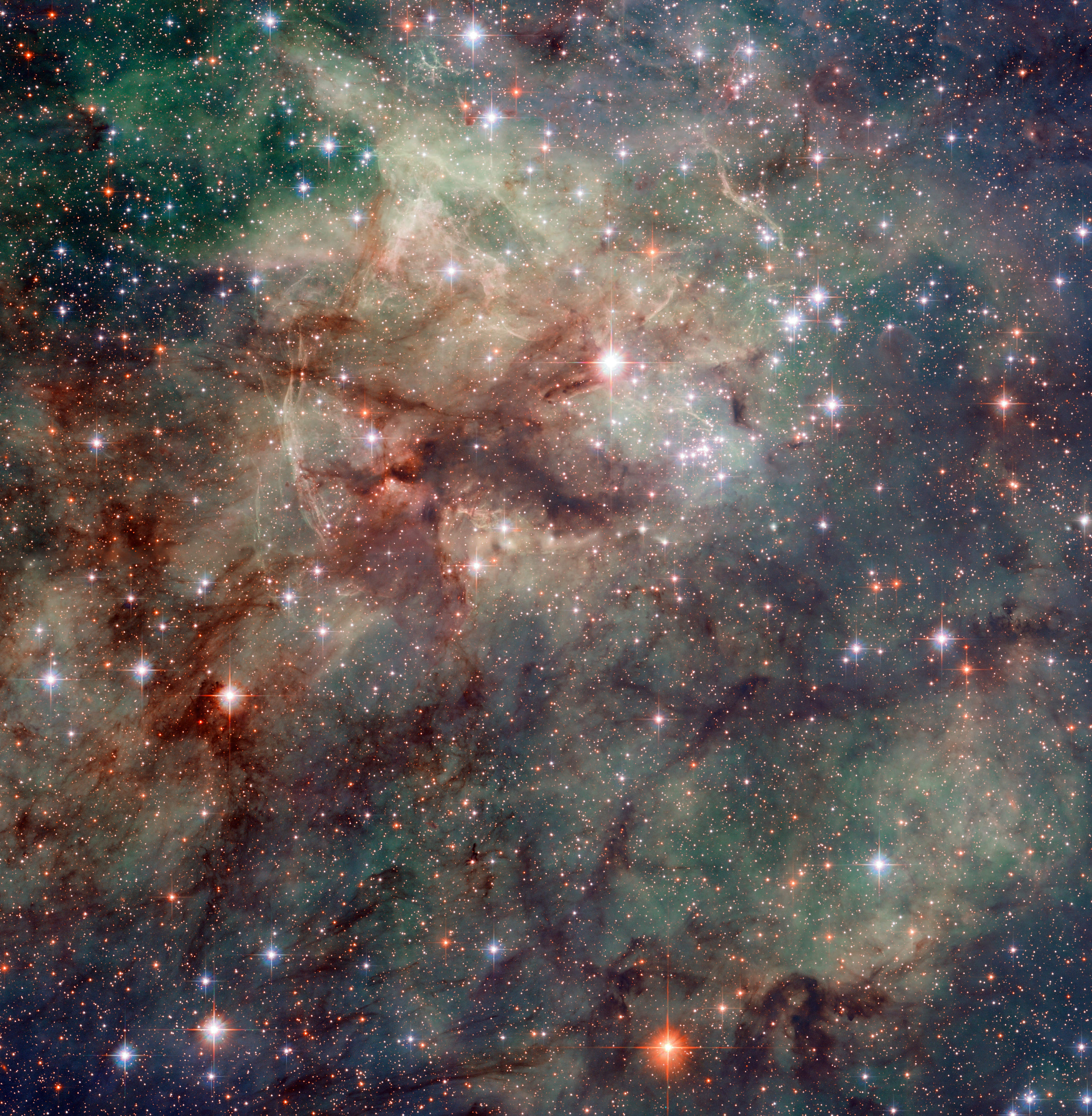 Närbild av stjärnor och gas i Tarantelnebulosan.